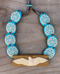 Tania Tupu Design, Inspired by the need for change, to be fearless, versatile and adaptable like the kārearea A statement piece featuring our kārearea center stage teamed up with a mix of the brown and black weave pattern beads.  Proudly handcrafted 3-dimensional NZ artworks handwoven with double-sided silk satin ribbon finished with an adjustable toggle.