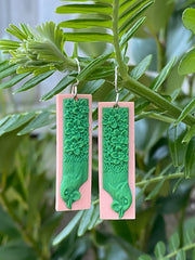 Tania Tupu Earrings: Te Kōkako is whanau to the saddleback and huia.  Once a common bird in our native forests, now this manu has declined in numbers.  A beautiful song-bird that is considered sacred by many Māori. In Māori myth, the kōkako filled its wattles with water and brought it to Maui as he fought the sun. Maui rewarded the bird by making its legs long and slender, enabling it to bound through the forest with ease