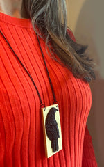 Tania Tupu Jewellery, Boisterous and confident long tūī bird pendant 2020 Winter new handcrafted 3-dimensional Tui on swinging long chain.  Confident spiritual warrior, the Tui brings harmony and holds power as a messenger to the gods.   Pantone resin colour option: Cream base with Black Tui, Navy Base with Cream Tui and Lime Apple Green base with Cream Tui