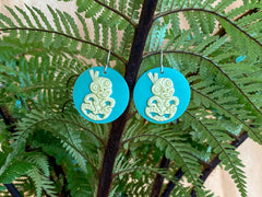 Stand out wearing an 80's earring size of 30 mm x 30 mm Wearable handcrafted 3-dimensional NZ artwork on sterling silver hooks. Tiki in this instance was inspired by the Maori Goddess of childbirth, Hineteiwaiwa. Shelter from any storm so you can think clearly, bring knowledge into your journey and keep evil spirits away so you can get on with life in your oasis. Designed as a little reminder that we can build strength and character through our cultural beliefs.