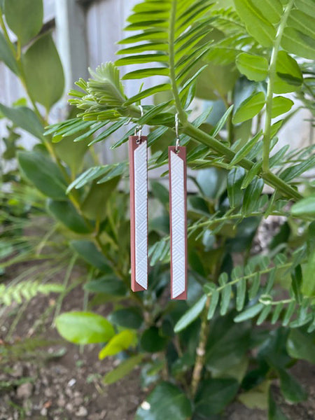 Tania Tupu's weaving together earrings. A long slender design representing Hineteiwaiwa the goddess of the house of weaving.   Newly launched design March 2020
