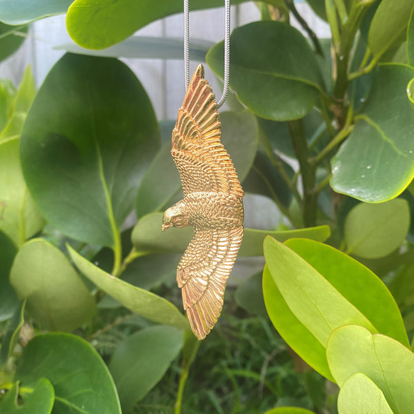 Tania Tupu latest Ngā Manu Collection Zinc Alloy Gold Plated Kārearea design Proudly handcrafted 3-dimensional NZ artwork on Silver 50cm Snake chain. 