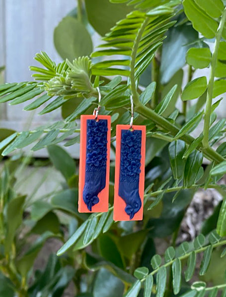 Tania Tupu Kōkako Earrings: Te Kōkako is whanau to the saddleback and huia.  Once a common bird in our native forests, now this manu has declined in numbers.  A beautiful song-bird that is considered sacred by many Māori. In Māori myth, the kōkako filled its wattles with water and brought it to Maui as he fought the sun. Maui rewarded the bird by making its legs long and slender, enabling it to bound through the forest with ease
