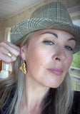 Tania Tupu sporting Kārearea Gold Earrings